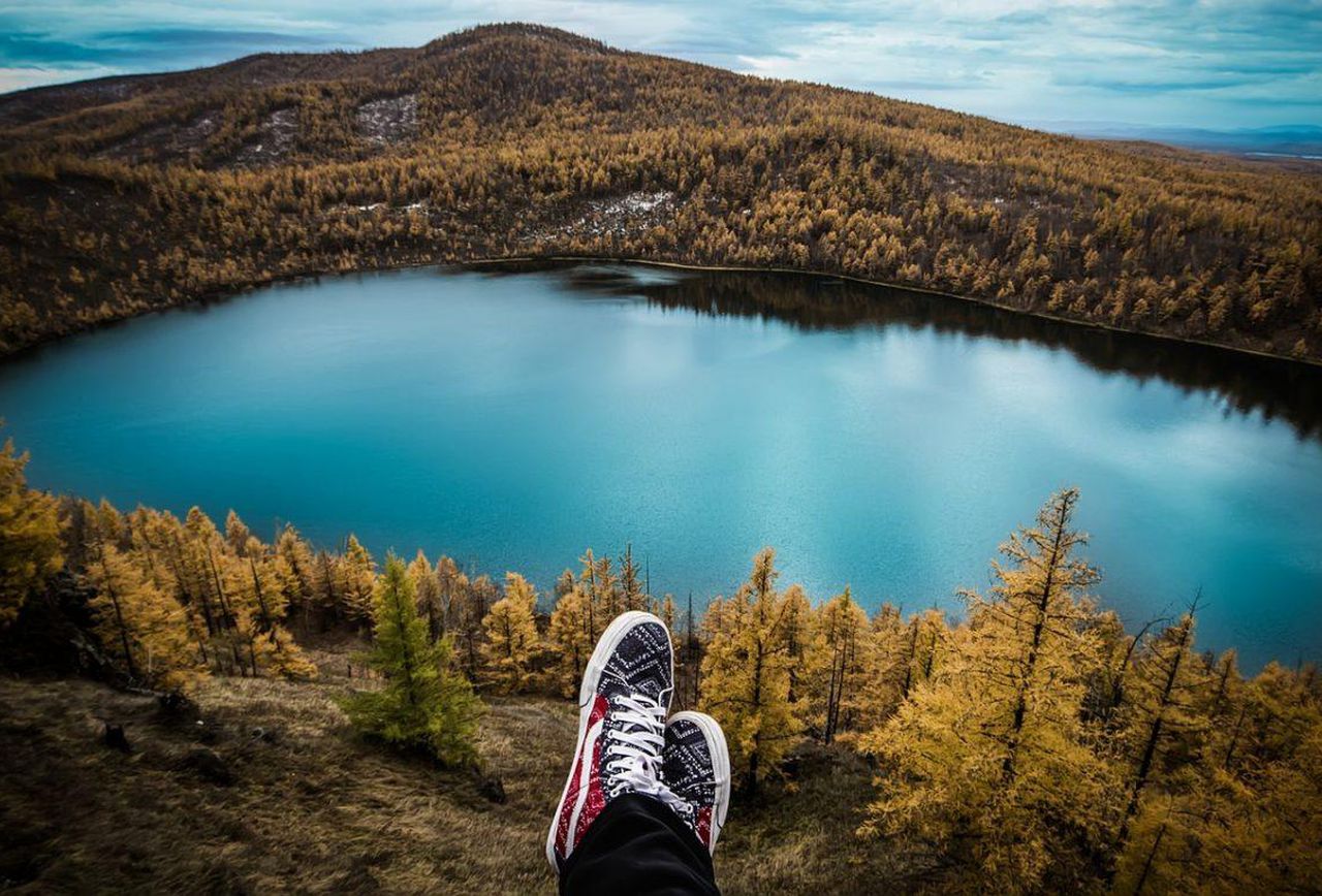 sneakers on a background of mountains