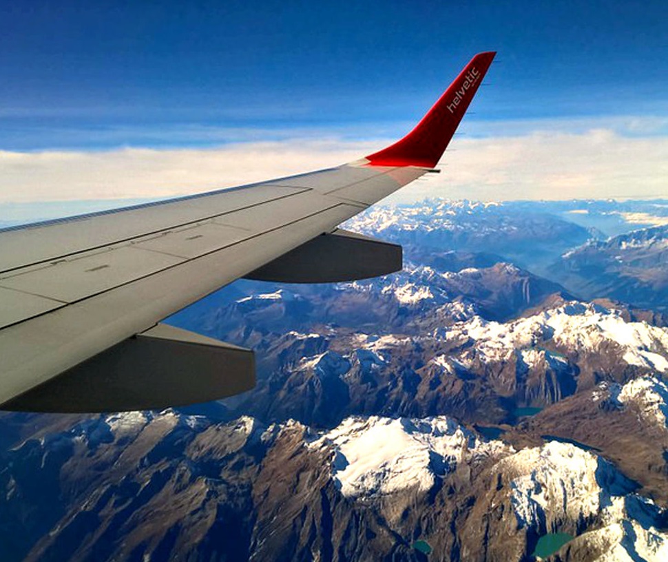 plane wing and mountains